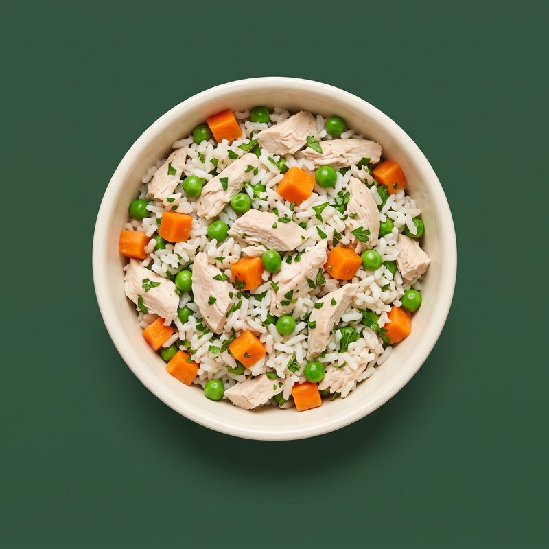 Chicken and Carrots topper in a cream bowl — shredded chicken with carrots, rice and peas